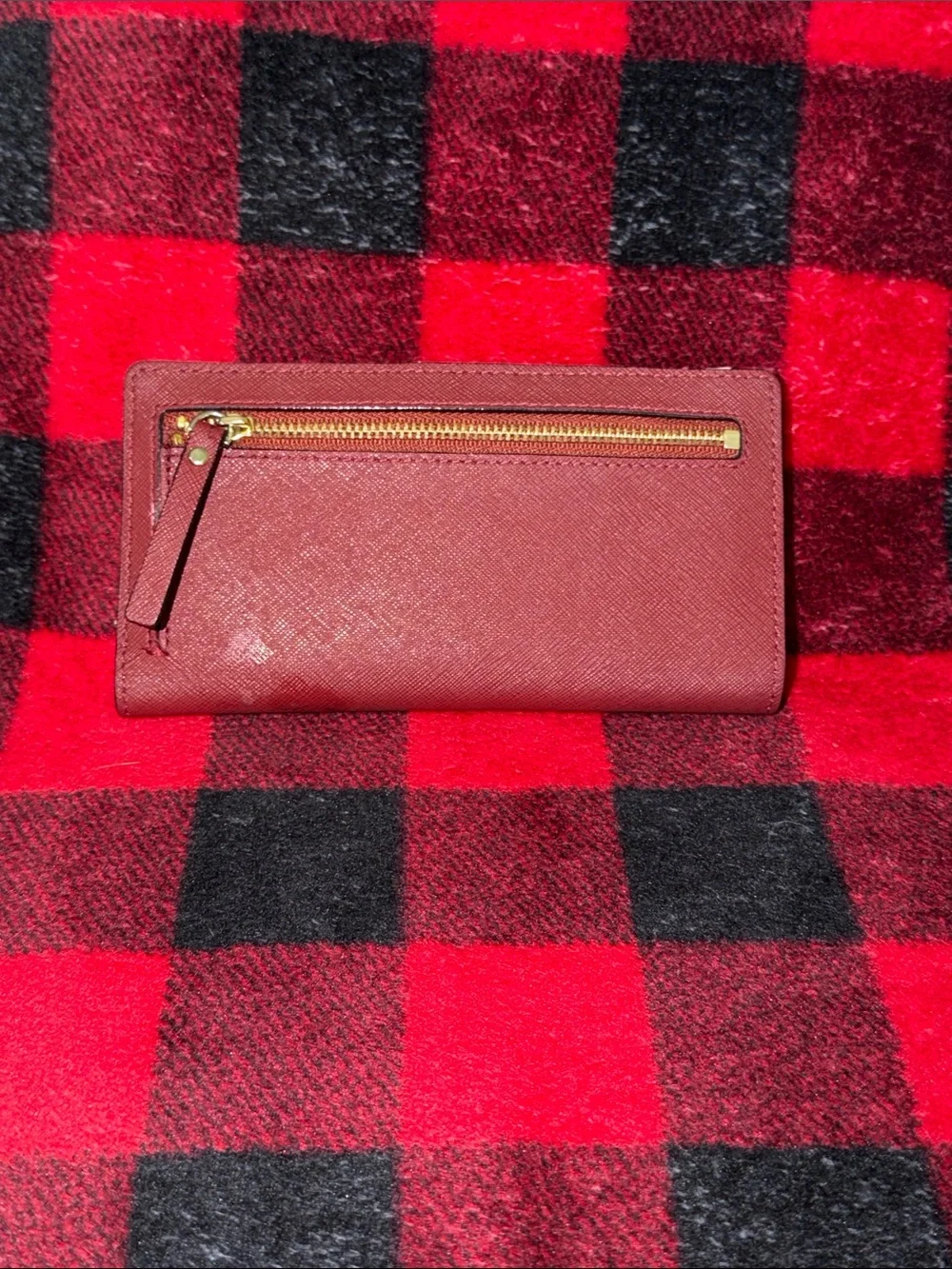 Kate Spade New York Staci large slim bifold wallet in a red currant shade